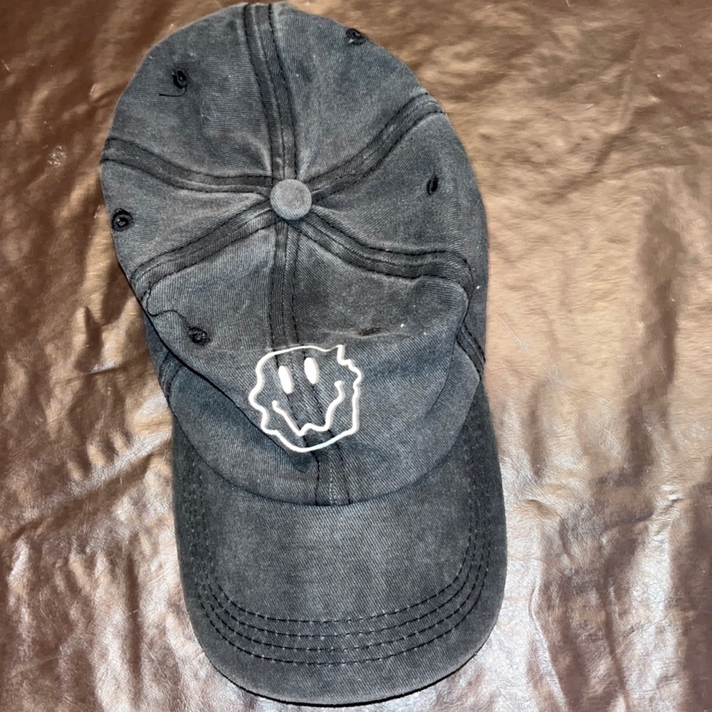 Black/grayish smiley face hat